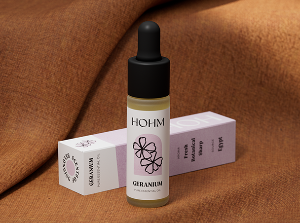 geranium essential oil with blanket background